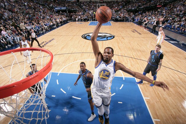DALLAS, TX - NOVEMBER 17: Kevin Durant #35 of the Golden State Warriors dunks the ball against the Dallas Mavericks on November 17, 2018 at the American Airlines Center in Dallas, Texas. NOTE TO USER: User expressly acknowledges and agrees that, by downloading and/or using this photograph, user is consenting to the terms and conditions of the Getty Images License Agreement. Mandatory Copyright Notice: Copyright 2018 NBAE (Photo by Glenn James/NBAE via Getty Images)