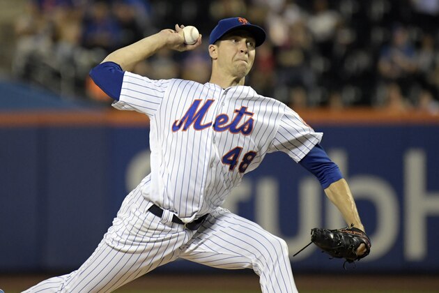 New York Mets pitcher Jacob deGrom delivers the ball to the Atlanta Braves during the second inning of a baseball game Wednesday, Sept. 26, 2018, in New York. (AP Photo/Bill Kostroun)