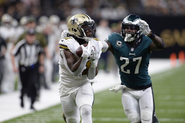 New Orleans Saints running back Alvin Kamara (41) pulls in a touchdown reception in front of Philadelphia Eagles strong safety Malcolm Jenkins (27) during the second half of an NFL football game in New Orleans, Sunday, Nov. 18, 2018. The Saints won 48-7. (AP Photo/Bill Feig)