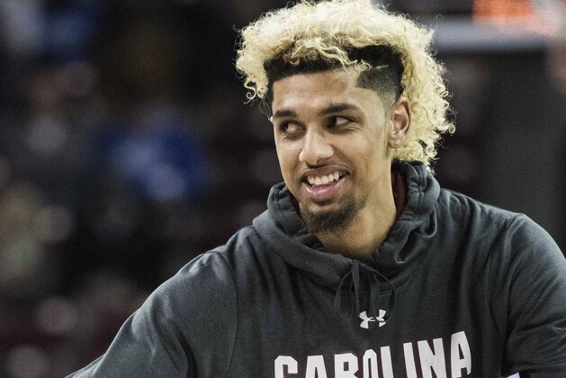FILE - In this Jan. 16, 2018, file photo, standout college basketball recruit Brian Bowen is photographed before an NCAA college basketball game in Columbia, S.C. A recruiter, a coach and a former Adidas executive are scheduled to go on trial in New York in a criminal case that exposed corruption in several top U.S. college basketball programs. It also led to the firing of Hall of Fame coach Rick Pitino of Lousiville and sidelined the playing career of Bowen. (AP Photo/Sean Rayford, File)