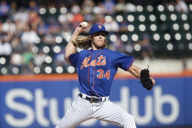 New York Mets' Noah Syndergaard delivers a pitch during the first inning of a baseball game against the Miami Marlins, Sunday, Sept. 30, 2018, in New York. (AP Photo/Jason DeCrow)