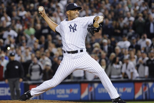 FILE - In this Sept. 26, 2013, file photo, New York Yankees reliever Mariano Rivera throws to a Tampa Bay Rays batter during the eighth inning of a baseball game at Yankee Stadium in New York. Rivera was making his final appearance at home for the Yankees. It could be another crowded Hall of Fame ceremony in 2019. After four players were voted in this year by the BBWAA, Rivera and Roy Halladay headline next year's ballot. (AP Photo/Bill Kostroun, File)