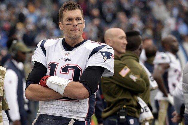 FILE - In this Sunday, Nov. 11, 2018, file photo, New England Patriots quarterback Tom Brady watches from the sideline after leaving the game in the second half of the Patriots' 34-10 loss to the Tennessee Titans in an NFL football game in Nashville, Tenn. Brady finds himself in the throes of some of his worst passing numbers in three seasons as the Patriots head into their bye week. What’s unclear is whether it’s been an aberration or the first signs of decline for the 41-year-old. (AP Photo/Mark Zaleski, File)