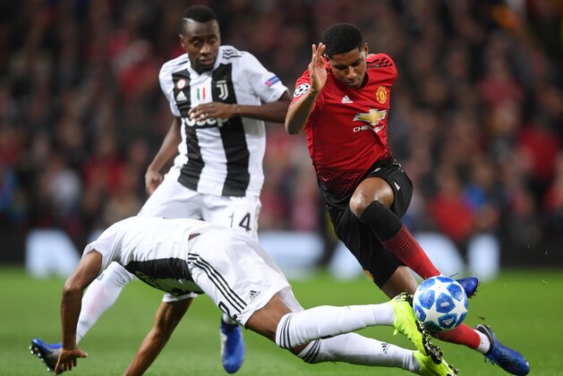 MANCHESTER, ENGLAND - OCTOBER 23:  Marcus Rashford of Manchester United is challenged by Alex Sandro of Juventus and Blaise Matuidi of Juventus during the Group H match of the UEFA Champions League between Manchester United and Juventus at Old Trafford on October 23, 2018 in Manchester, United Kingdom.  (Photo by Laurence Griffiths/Getty Images)