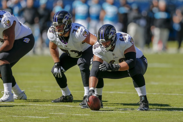 Baltimore Ravens center Matt Skura, right, and offensive guard Marshal Yanda at the line of scrimmage in an NFL football game against the Carolina Panthers in Charlotte, N.C., Sunday, Oct. 28, 2018. (AP Photo/Nell Redmond)