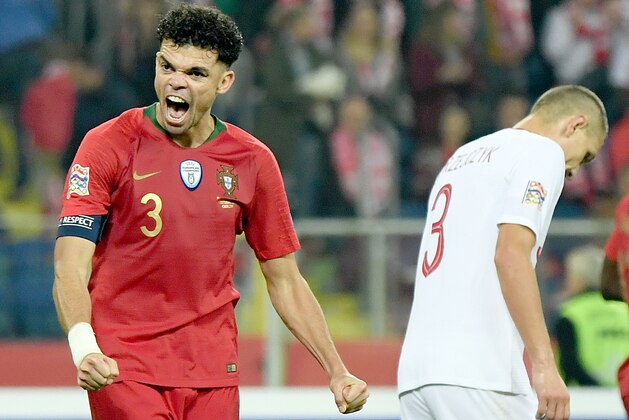 TOPSHOT - Portugal's defender Pepe (L) react at the end of the UEFA Nations League football match Poland v Portugal at the Slaski Stadium in Chorzow, Poland on October 11, 2018. (Photo by Janek SKARZYNSKI / AFP)        (Photo credit should read JANEK SKARZYNSKI/AFP/Getty Images)
