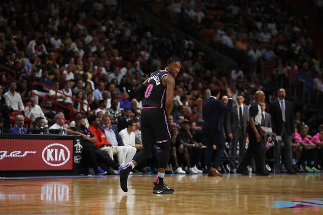 Miami Heat guard Josh Richardson runs down the court as he looses his shoe during the second half of an NBA basketball game against Los Angeles Lakers, Sunday, Nov. 18, 2018, in Miami, Fla. (AP Photo/Brynn Anderson)