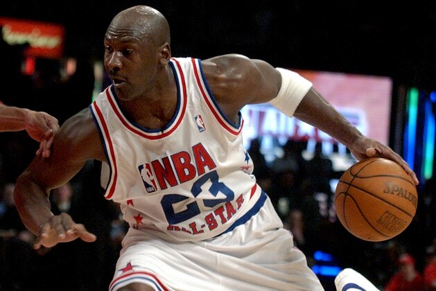 ** FILE ** In this Feb. 9, 2003 file photo, Washington Wizards' Michael Jordan, East, moves the ball on the West during first half play of the 2003 NBA All Star Game in Atlanta.  Jordan along with John Stockton,  David Robinson,  Utah Jazz coach Jerry Sloan and Rutgers women's coach C. Vivian Stringer were all elected to the class of 2009 Basketball Hall of Fame on Monday, April 6, 2009. Induction is Sept. 10-12 in Springfield, Mass., home of the Naismith Memorial Basketball Hall of Fame.  (AP Photo/John Bazemore)