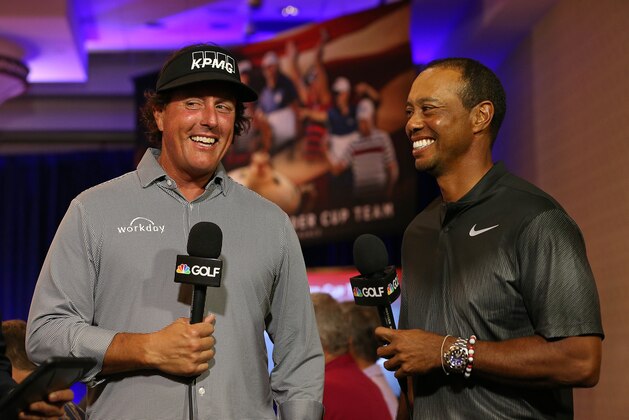 WEST CONSHOHOCKEN, PA - SEPTEMBER 04: Phil Mickelson and Tiger Woods are interviewed by the Golf Channel after being named as Captain's Picks along with Bryson DeChambeau by U.S. Ryder Cup Captain for the 2018 U.S. team during a press conference at the Philadelphia Marriott West on September 4, 2018 in West Conshohocken, Pennsylvania. (Photo by Rich Schultz/Getty Images)