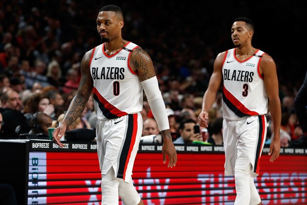 PORTLAND, OR - NOVEMBER 04:  CJ McCollum #3 of the Portland Trail Blazers and Damian Lillard #0 walk off the court against the Minnesota Timberwolves at Moda Center on November 4, 2018 in Portland, Oregon.  (Photo by Jonathan Ferrey/Getty Images,)  NOTE TO USER: User expressly acknowledges and agrees that, by downloading and or using this photograph, User is consenting to the terms and conditions of the Getty Images License Agreement.  (Photo by Jonathan Ferrey/Getty Images,)