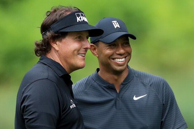 AKRON, OH - AUGUST 01:  Phil Mickelson (L) and Tiger Woods smile during a practice round prior to the World Golf Championships-Bridgestone Invitational at Firestone Country Club South Course on August 1, 2018 in Akron, Ohio.  (Photo by Sam Greenwood/Getty Images)