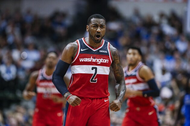 Washington Wizards guard John Wall (2) celebrates a three-point shot during the second half of an NBA basketball game against the Dallas Mavericks, Tuesday, Nov. 6, 2018, in Dallas. Dallas won 119-100. (AP Photo/Brandon Wade)