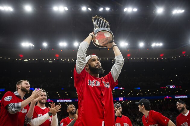 BOSTON, MA - NOVEMBER 1: David Price of the Boston Red Sox celebrates with The Commissioner's Trophy during the first quarter of the game between the Boston Celtics and the Milwaukee Bucks at TD Garden on November 1, 2018 in Boston, Massachusetts. (Photo by Maddie Meyer/Getty Images)