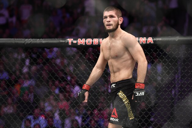 LAS VEGAS, NV - OCTOBER 06:   Khabib Nurmagomedov of Russia stares across at Conor McGregor of Ireland in their UFC lightweight championship bout during the UFC 229 event inside T-Mobile Arena on October 6, 2018 in Las Vegas, Nevada. (Photo by Brandon Magnus/Zuffa LLC/Zuffa LLC via Getty Images)