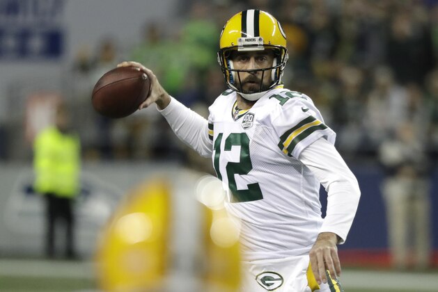 Green Bay Packers quarterback Aaron Rodgers passes against the Seattle Seahawks during the first half of an NFL football game, Thursday, Nov. 15, 2018, in Seattle. (AP Photo/Elaine Thompson)