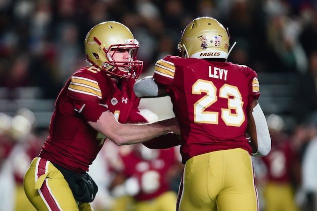 CHESTNUT HILL, MA - NOVEMBER 10:  Quarterback EJ Perry #4 of the Boston College Eagles hands off to Travis Levy #23 of the Boston College Eagles during the second quarter of the game against the Clemson Tigers at Alumni Stadium on November 10, 2018 in Chestnut Hill, Massachusetts.  (Photo by Omar Rawlings/Getty Images)