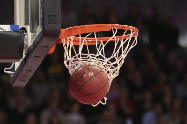 BONN, GERMANY - MARCH 11: The ball is seen in the basketball hoop during the Basketball Bundesliga match between Telekom Baskets Bonn and Science City Jena at Telekom Dome on March 11, 2018 in Bonn, Germany. (Photo by TF-Images/TF-Images via Getty Images)