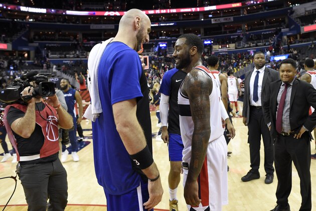 Washington Wizards guard John Wall, right, laughs with Los Angeles Clippers center Marcin Gortat, left, of Poland, after an NBA basketball game, Tuesday, Nov. 20, 2018, in Washington. The Wizards won 125-118. (AP Photo/Nick Wass)
