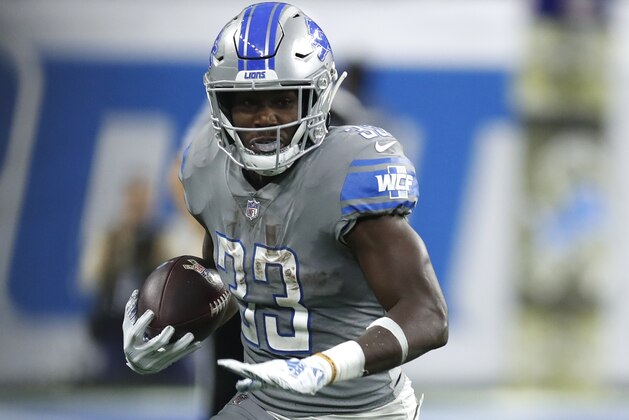 Detroit Lions running back Kerryon Johnson (33) runs the ball against the Carolina Panthers during an NFL football game Sunday, Nov. 18, 2018, in Detroit. The Lions won the game 20-19. (Jeff Haynes/AP Images for Panini)