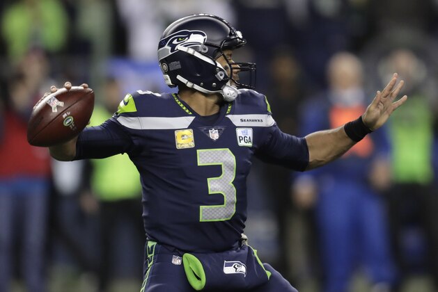 Seattle Seahawks quarterback Russell Wilson throws a pass against the Green Bay Packers during the first half of an NFL football game Thursday, Nov. 15, 2018, in Seattle. (AP Photo/Stephen Brashear)