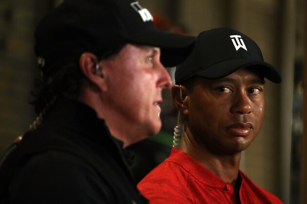 LAS VEGAS, NV - NOVEMBER 20:  (EXCLUSIVE COVERAGE) Tiger Woods looks over at Phil Mickelson as they do a spot for TV before The Match at Shadow Creek Golf Course on November 20, 2018 in Las Vegas, Nevada.  (Photo by Christian Petersen/Getty Images for The Match)