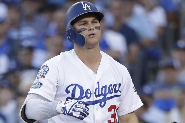Los Angeles Dodgers' Joc Pederson reacts after striking out during the first inning of Game 3 of the National League Championship Series baseball game against the Milwaukee Brewers Monday, Oct. 15, 2018, in Los Angeles. (AP Photo/Jae Hong)
