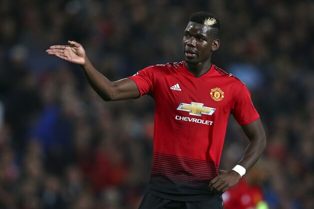 ManU midfielder Paul Pogba reacts after missing a chance to score during the Champions League group H soccer match between Manchester United and Juventus at Old Trafford, Manchester, England, Tuesday, Oct. 23, 2018. (AP Photo/Dave Thompson)