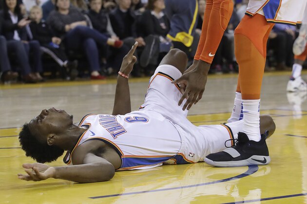 Oklahoma City Thunder guard Hamidou Diallo (6) reacts after being injured during the second half of the team's NBA basketball game against the Golden State Warriors in Oakland, Calif., Wednesday, Nov. 21, 2018. Diallo left the game on a stretcher after the play. (AP Photo/Jeff Chiu)