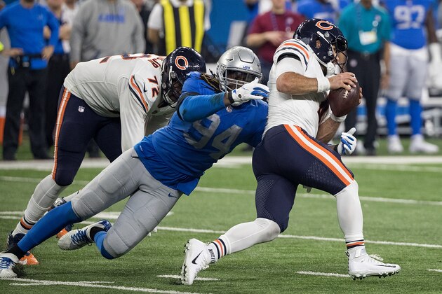 DETROIT, MI - NOVEMBER 22: Quarterback Chase Daniel #4 of the Chicago Bears runs with the ball while being wrapped up by Ezekiel Ansah #94 of the Detroit Lions during an NFL game at Ford Field on November 22, 2018 in Detroit, Michigan. (Photo by Dave Reginek/Getty Images) DETROIT, MI - NOVEMBER 22: Quarterback Chase Daniel #4 of the Chicago Bears runs with the ball while being wrapped up by Ezekiel Ansah #94 of the Detroit Lions during an NFL game at Ford Field on November 22, 2018 in Detroit, Michigan. (Photo by Dave Reginek/Getty Images)