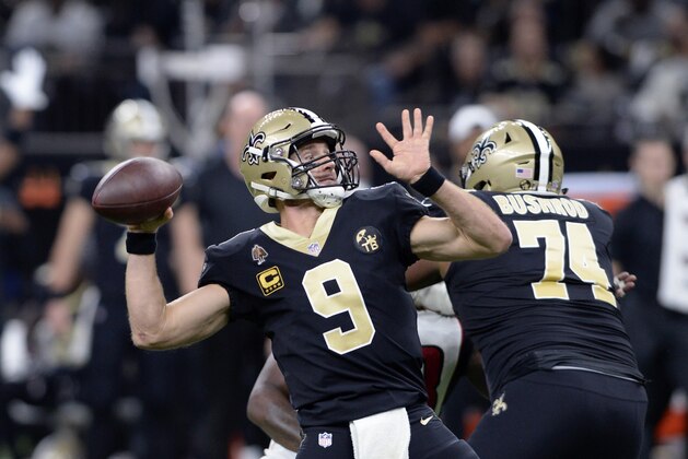 New Orleans Saints quarterback Drew Brees (9) throws a touchdown pass on their first drive of the game in the first half of an NFL football game against the Atlanta Falcons in New Orleans, Thursday, Nov. 22, 2018. (AP Photo/Bill Feig)