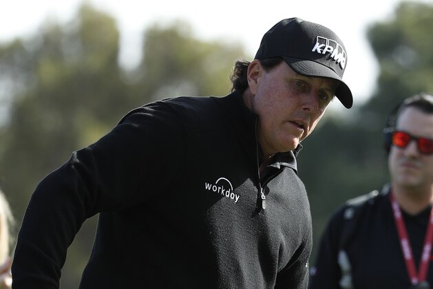 Phil Mickelson warms up on a practice green before a golf match with Tiger Woods at Shadow Creek golf course Friday, Nov. 23, 2018, in Las Vegas. (AP Photo/John Locher)