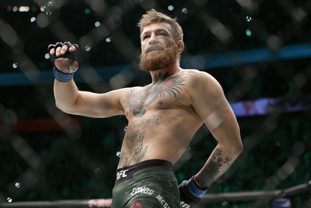 Conor McGregor walks in the cage before fighting Khabib Nurmagomedov in a lightweight title mixed martial arts bout at UFC 229 in Las Vegas, Saturday, Oct. 6, 2018. (AP Photo/John Locher)