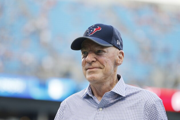 Houston Texans owner Robert C. McNair walks on the field before the first half of an NFL preseason football game between the Carolina Panthers and the Houston Texans, Wednesday, Aug. 9, 2017, in Charlotte, N.C. (AP Photo/Jason E. Miczek)