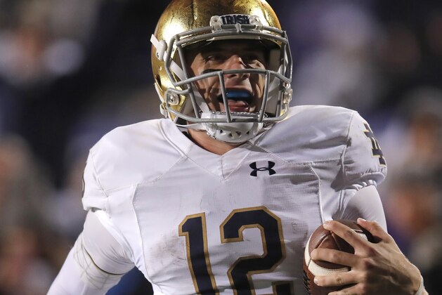 Notre Dame's Ian Book celebrates as he scores a touchdown against Northwestern during the second half of an NCAA college football game Saturday, Nov. 3, 2018, in Evanston, Ill. (AP Photo/Jim Young)