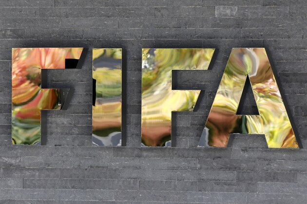 FILE - In this Sept. 25, 2015 file photo, the FIFA logo is fixed on a wall of the FIFA headquarters in Zurich, Switzerland. So far, 16 of FIFA’s 209 member associations have been implicated in an ongoing U.S. Department of Justice investigation of decades of soccer bribery and graft, by virtue of the fact that either their presidents or ex-presidents _ or both in the cases of Brazil, Honduras and Guatemala _ are among those indicted or who have pleaded guilty.  (AP Photo/Michael Probst, File)