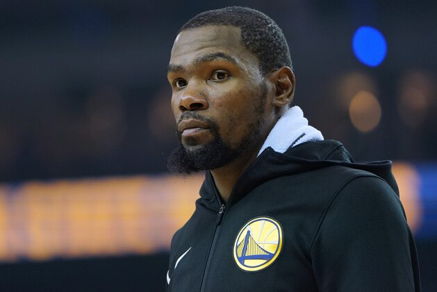 OAKLAND, CA - NOVEMBER 21:  Kevin Durant #35 of the Golden State Warriors looks on against the Oklahoma City Thunder during an NBA basketball game at ORACLE Arena on November 21, 2018 in Oakland, California. NOTE TO USER: User expressly acknowledges and agrees that, by downloading and or using this photograph, User is consenting to the terms and conditions of the Getty Images License Agreement.  (Photo by Thearon W. Henderson/Getty Images)