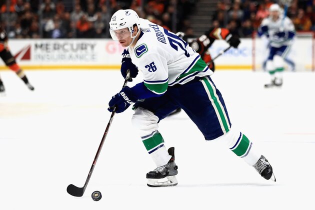ANAHEIM, CA - NOVEMBER 21:  Antoine Roussel #26 of the Vancouver Canucks skates with the puck during the second period of a game against the Anaheim Ducks at Honda Center on November 21, 2018 in Anaheim, California.  (Photo by Sean M. Haffey/Getty Images)