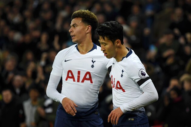 LONDON, ENGLAND - NOVEMBER 24:  Heung-Min Son of Tottenham Hotspur celebrates with teammate Dele Alli after scoring his team's third goal during the Premier League match between Tottenham Hotspur and Chelsea FC at Tottenham Hotspur Stadium on November 24, 2018 in London, United Kingdom.  (Photo by David Ramos/Getty Images)