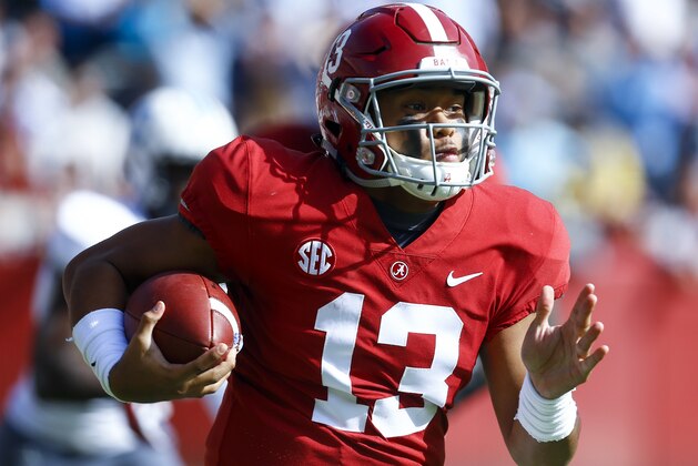 Alabama quarterback Tua Tagovailoa (13) carries the ball during the first half of an NCAA college football game against Citadel, Saturday, Nov. 17, 2018, in Tuscaloosa, Ala. (AP Photo/Butch Dill)