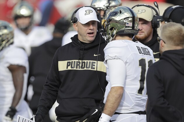 Purdue head coach Jeff Brohm talks quarterback David Blough (11) during the second half of an NCAA college football game against Indiana, Saturday, Nov. 24, 2018, in Bloomington, Ind. Purdue won 28-21. (AP Photo/Darron Cummings)