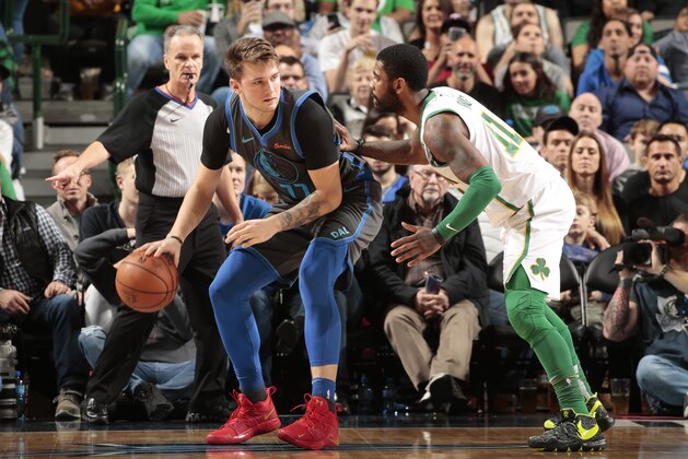 DALLAS, TX - NOVEMBER 24: Luka Doncic #77 of the Dallas Mavericks handles the ball against Kyrie Irving #11 of the Boston Celtics on November 24, 2018 at the American Airlines Center in Dallas, Texas. NOTE TO USER: User expressly acknowledges and agrees that, by downloading and or using this photograph, User is consenting to the terms and conditions of the Getty Images License Agreement. Mandatory Copyright Notice: Copyright 2018 NBAE (Photo by Glenn James/NBAE via Getty Images)