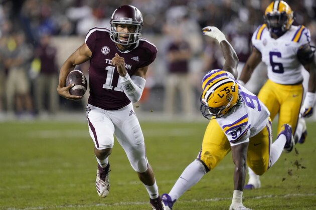 Texas A&M quarterback Kellen Mond (11) breaks away from LSU defensive end Glen Logan (97) during the first half of an NCAA college football game Saturday, Nov. 24, 2018, in College Station, Texas. (AP Photo/David J. Phillip)