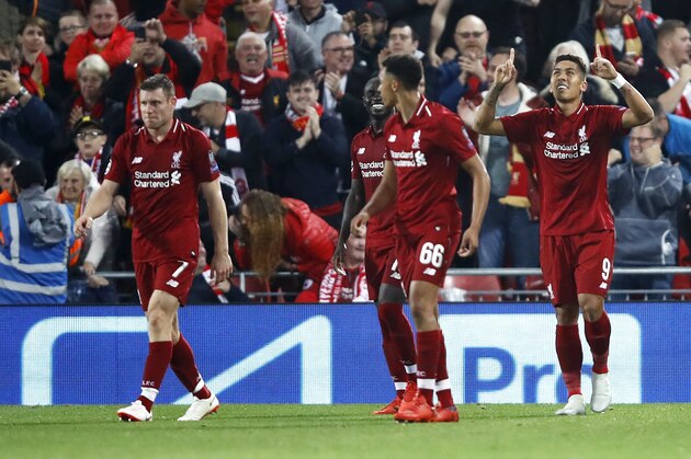 LIVERPOOL, ENGLAND - SEPTEMBER 18:  Roberto Firmino of Liverpool celebrates after scoring his team's third goal during the Group C match of the UEFA Champions League between Liverpool and Paris Saint-Germain at Anfield on September 18, 2018 in Liverpool, United Kingdom.  (Photo by Julian Finney/Getty Images)