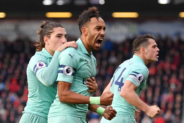 BOURNEMOUTH, ENGLAND - NOVEMBER 25:  Pierre-Emerick Aubameyang of Arsenal celebrates after scoring his team's second goal with Hector Bellerin during the Premier League match between AFC Bournemouth and Arsenal FC at Vitality Stadium on November 25, 2018 in Bournemouth, United Kingdom.  (Photo by Dan Mullan/Getty Images)