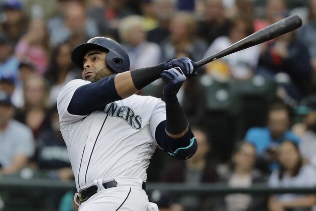 Seattle Mariners Nelson Cruz watches his two-run home run during the first inning of the team's baseball game against the Toronto Blue Jays, Thursday, Aug. 2, 2018, in Seattle. (AP Photo/Ted S. Warren)