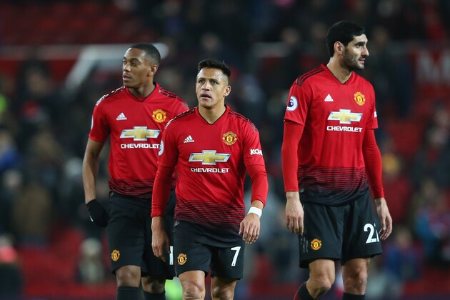 MANCHESTER, ENGLAND - NOVEMBER 24:  Alexis Sanchez, Anthony Martial and Marouane Fellaini of Manchester United look dejected after the Premier League match between Manchester United and Crystal Palace at Old Trafford on November 24, 2018 in Manchester, United Kingdom.  (Photo by Alex Livesey/Getty Images)