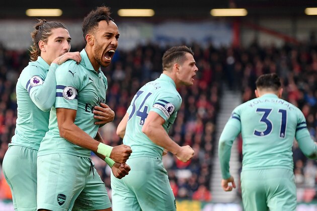 BOURNEMOUTH, ENGLAND - NOVEMBER 25:  Pierre-Emerick Aubameyang of Arsenal celebrates after scoring his team's second goal with Hector Bellerin during the Premier League match between AFC Bournemouth and Arsenal FC at Vitality Stadium on November 25, 2018 in Bournemouth, United Kingdom.  (Photo by Dan Mullan/Getty Images)