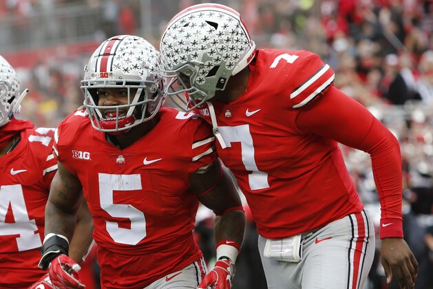 Ohio State running back Mike Weber, left, celebrates his touchdown against Michigan with teammate quarterback Dwayne Haskins during the second half of an NCAA college football game Saturday, Nov. 24, 2018, in Columbus, Ohio. Ohio State beat Michigan 62-39. (AP Photo/Jay LaPrete)