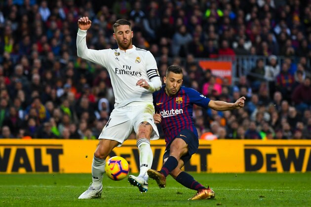 BARCELONA, SPAIN - OCTOBER 28:  Jordi Alba of FC Barcelona competes for the ball with Sergio Ramos of Real Madrid CF during the La Liga match between FC Barcelona and Real Madrid CF at Camp Nou on October 28, 2018 in Barcelona, Spain.  (Photo by David Ramos/Getty Images)
