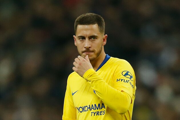 Chelsea's Belgian midfielder Eden Hazard gestures during the English Premier League football match between Tottenham Hotspur and Chelsea at Wembley Stadium in London, on November 24, 2018. (Photo by Ian KINGTON / various sources / AFP) / RESTRICTED TO EDITORIAL USE. No use with unauthorized audio, video, data, fixture lists, club/league logos or 'live' services. Online in-match use limited to 45 images, no video emulation. No use in betting, games or single club/league/player publications.        (Photo credit should read IAN KINGTON/AFP/Getty Images)